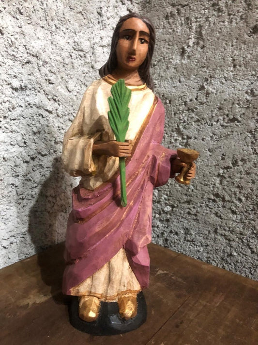 St. Lucie's carved wood figure